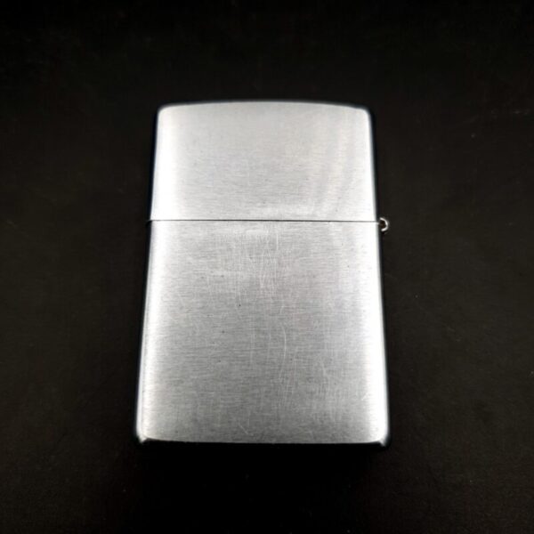 1999 Zippo brushed chrome lighter with etched golf design and original box