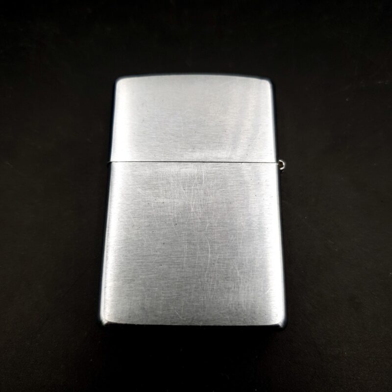 1999 Zippo brushed chrome lighter with etched golf design and original box