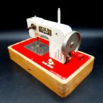 Vintage 1960s Müller Regina Model 730/2 battery-operated toy sewing machine
