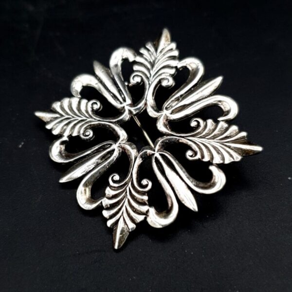 Vintage silver fleur-de-lis brooch with stylised decorative design
