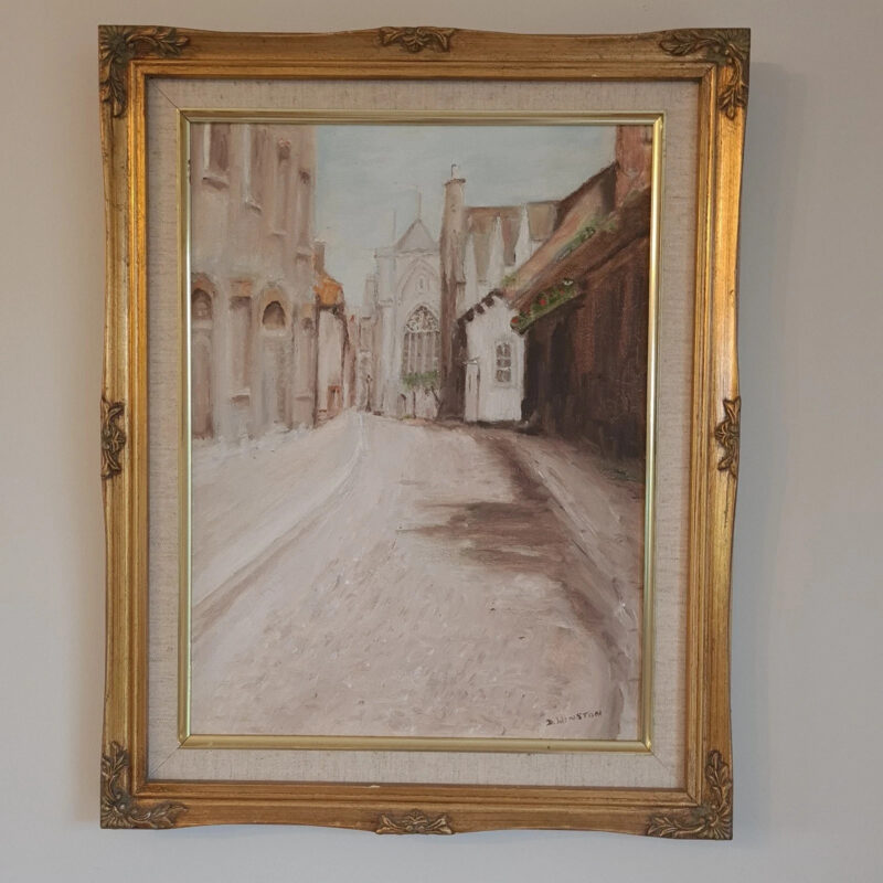 Signed D. Winston oil painting of a narrow historic street leading towards a Gothic church or cathedral