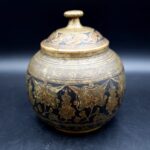 Antique Indian brass lidded jar with hand-engraved geometric floral decoration in Benares style