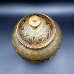 Antique Indian brass lidded jar with hand-engraved geometric floral decoration in Benares style