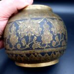 Antique Indian brass lidded jar with hand-engraved geometric floral decoration in Benares style