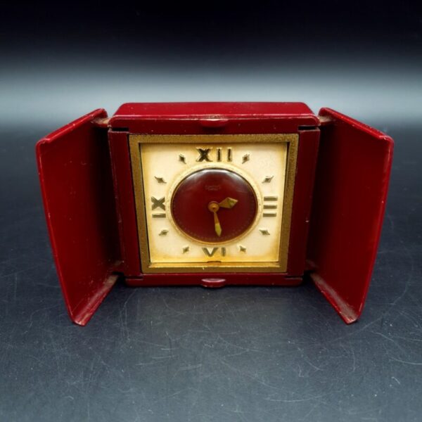 Vintage Smiths Empire travel clock in deep red plastic opening case, c.1940s