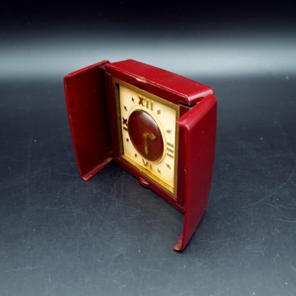 Vintage Smiths Empire travel clock in deep red plastic opening case, c.1940s