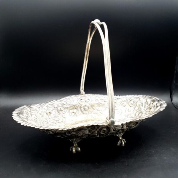 Antique JGS silver-plated bride’s basket with swing handle and floral scroll decoration
