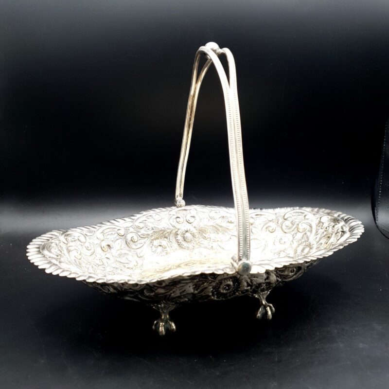 Antique JGS silver-plated bride’s basket with swing handle and floral scroll decoration