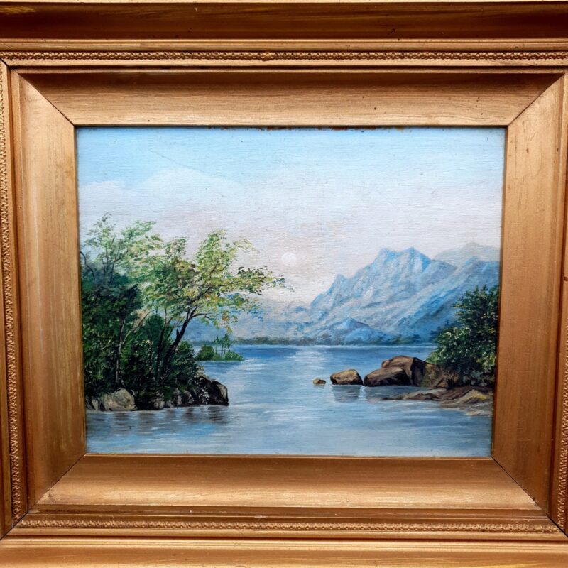 Antique Victorian landscape painting showing mountains overlooking a lake