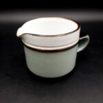 Vintage Denby Romance stoneware milk jug with floral decoration and green border