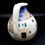 Vintage Greek pottery jug with hand-painted Mediterranean street scene