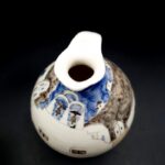 Vintage Greek pottery jug with hand-painted Mediterranean street scene