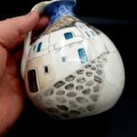 Vintage Greek pottery jug with hand-painted Mediterranean street scene