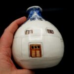 Vintage Greek pottery jug with hand-painted Mediterranean street scene