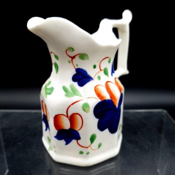Antique English Imari-style cream jug with hand-painted floral decoration