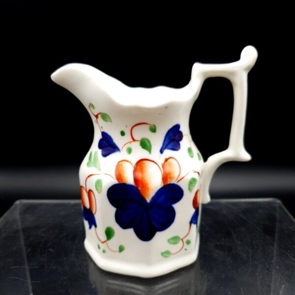 Antique English Imari-style cream jug with hand-painted floral decoration