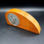 Silver-coloured fern emblem marked NZ on New Zealand mantel clock