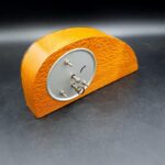 Side view of vintage New Zealand pāua shell desk clock