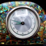 Vintage New Zealand pāua shell mantel clock with silver-coloured NZ fern