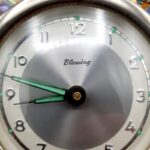 Vintage New Zealand pāua shell mantel clock with silver-coloured NZ fern