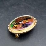 Alfano brooch showing miniature Rio de Janeiro tropical scene beneath glass