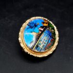 Close-up of iridescent butterfly wing in vintage Alfano Rio brooch