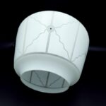 White geometric glass light shade shown from the side