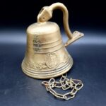 Vintage Brass Pull Bell with chain and wall attachment Bell is 9cm tall 690g