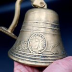 Vintage Brass Pull Bell with chain and wall attachment Bell is 9cm tall 690g