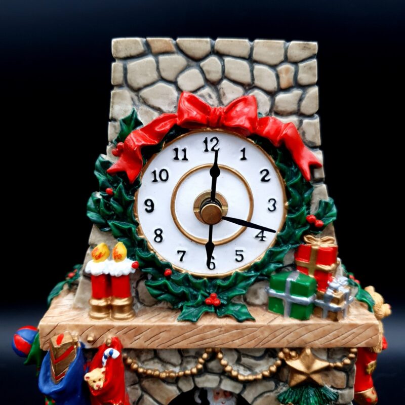 1990s Avon Christmas clock with Santa and festive fireplace scene